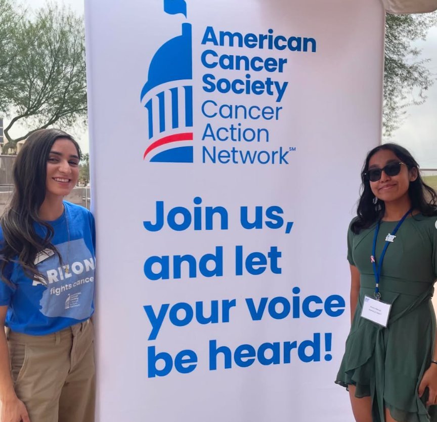 Ariana beside an American Cancer Society Cancer Action Network banner at the Arizona State Capitol